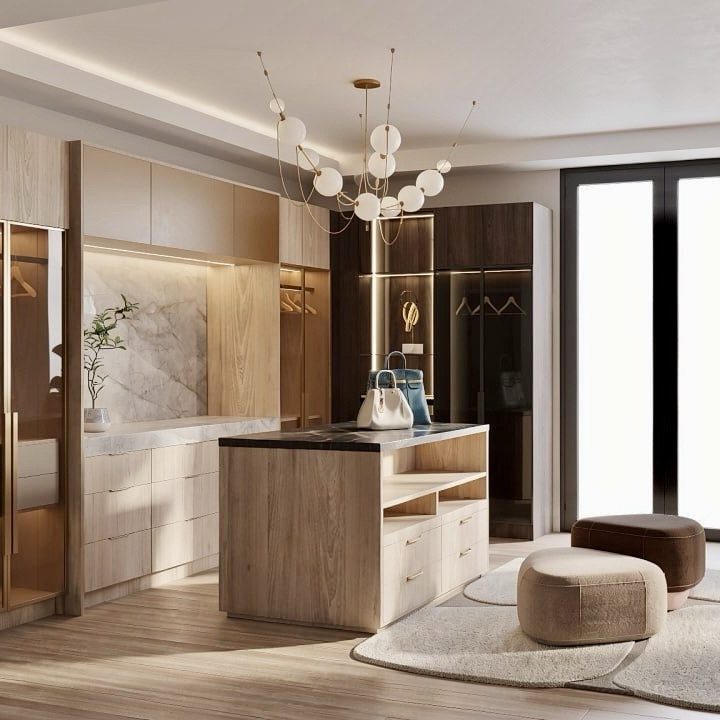 Modern walk-in closet with tinted glass doors and frosted bronze upper cabinets in warm tones