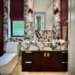 Luxury Bathroom design with viola marble and custom walnut floating vanity with brass elements