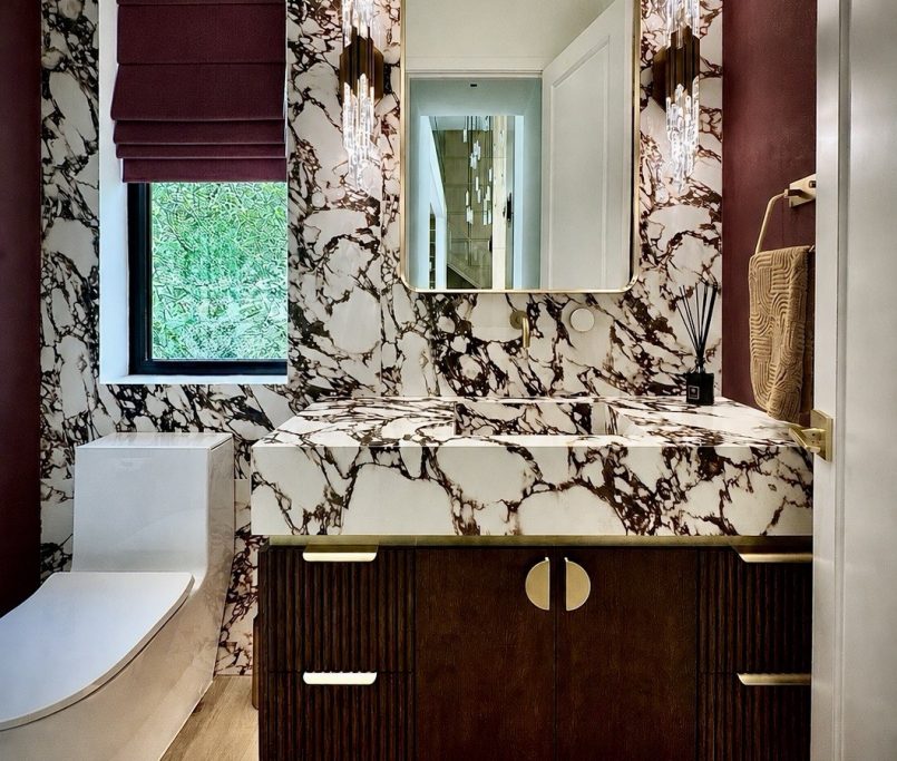 Luxury Bathroom design with viola marble and custom walnut floating vanity with brass elements